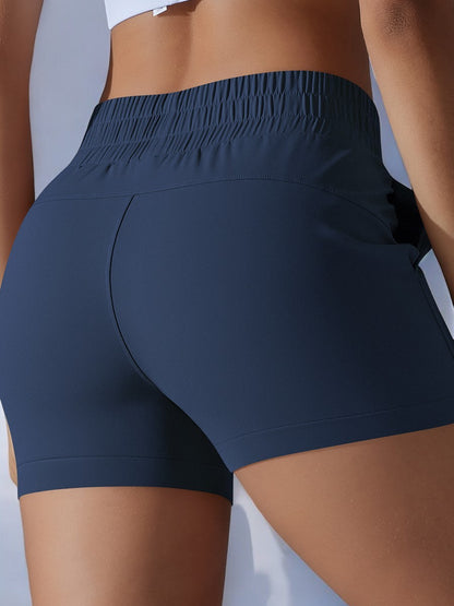 Pantalones cortos deportivos de cintura alta para mujer de Anna-Kaci con cinturilla elástica y bolsillos laterales