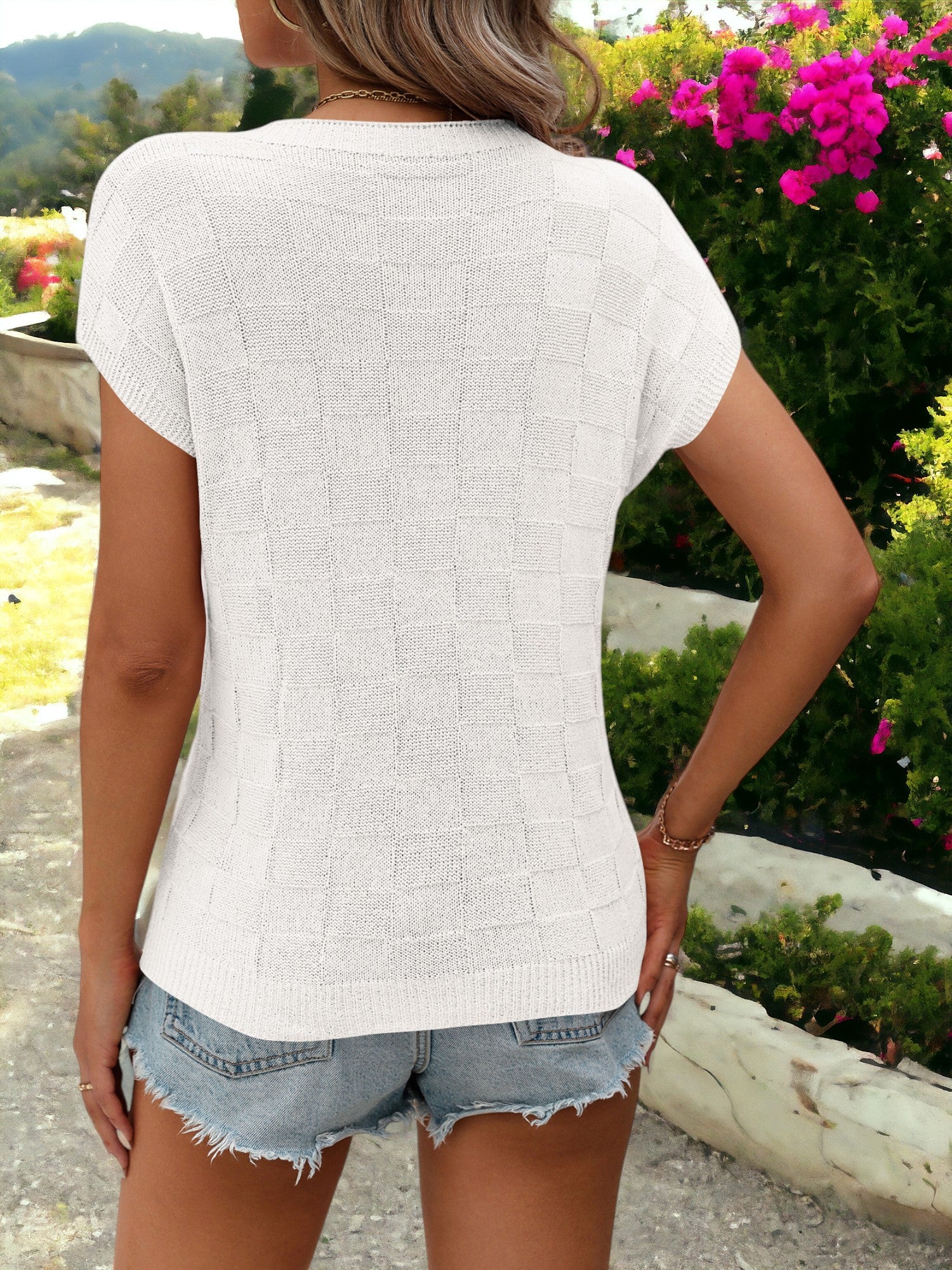 Camisa tipo pulóver con cuello redondo, bolsillos laterales y estampado de cuadros detallados