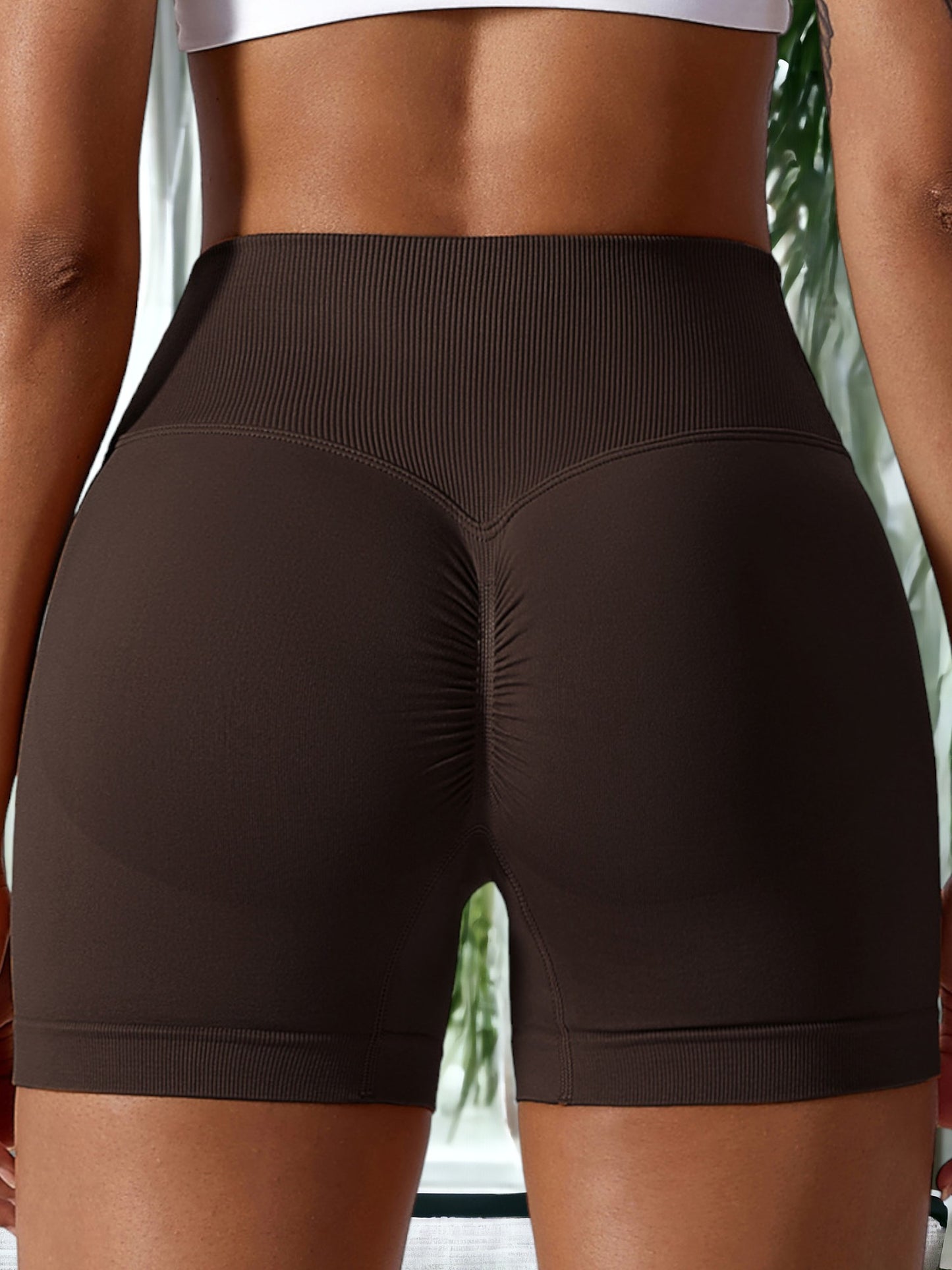 Pantalones cortos deportivos elásticos de cintura alta sin costuras