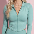 Black women's top with long sleeve, slim fit and zip front