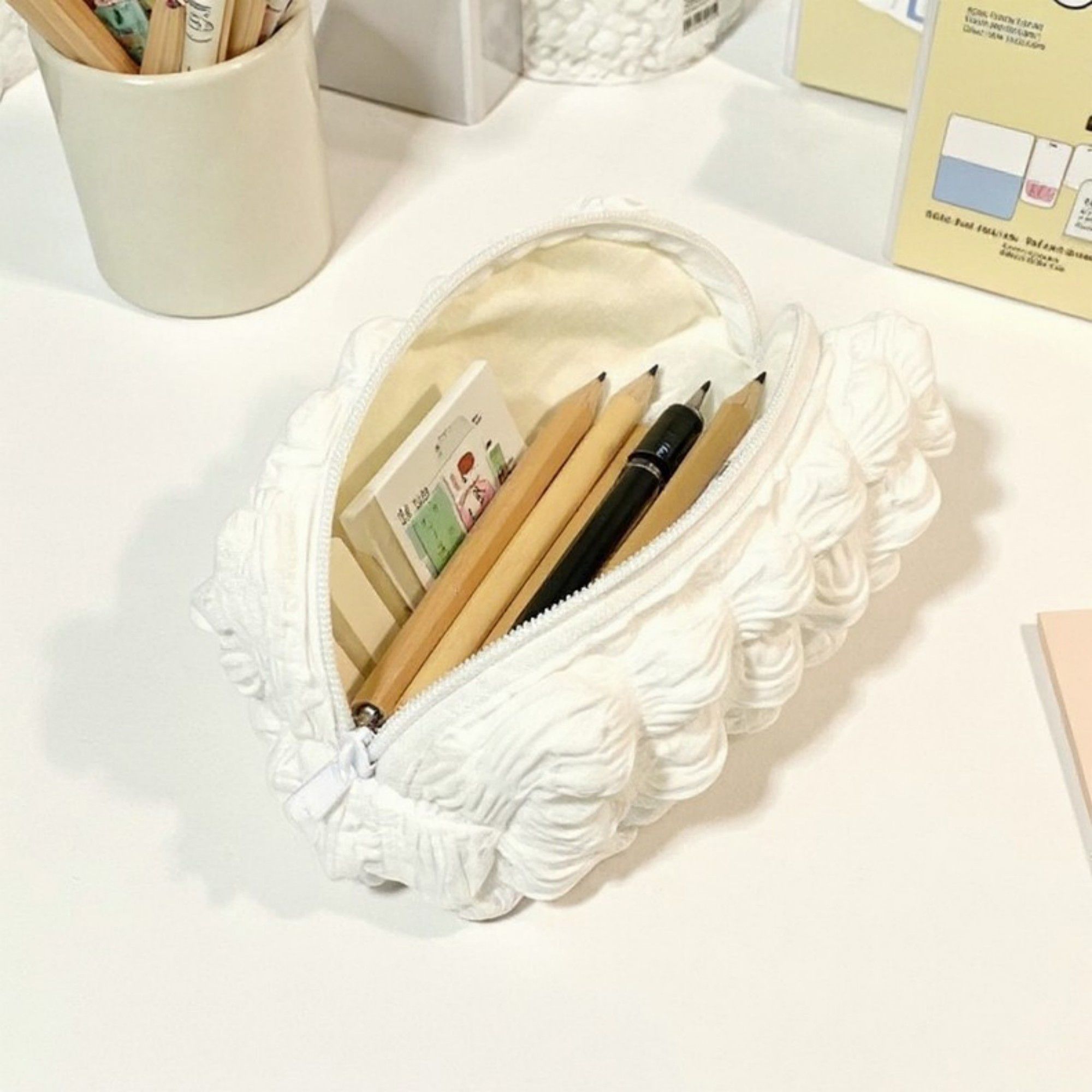 Whipped Cream-Inspired Zipper Pouch with Soft Sculpted Texture and Compact Storage Design