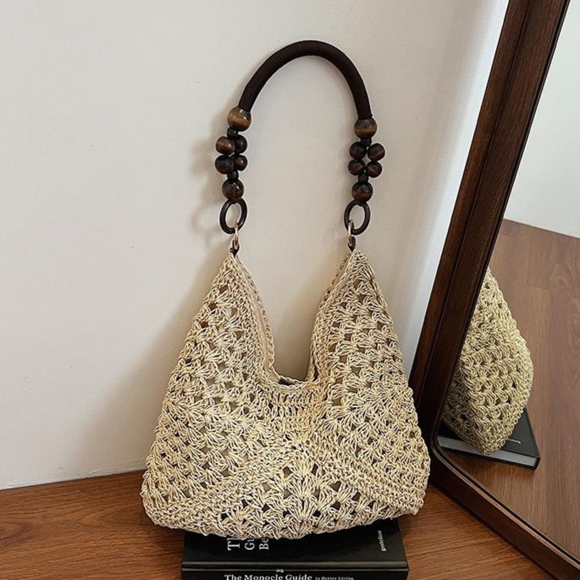 Woven Straw Hobo Bag with Wooden Handle Bead Accents and Spacious Interior