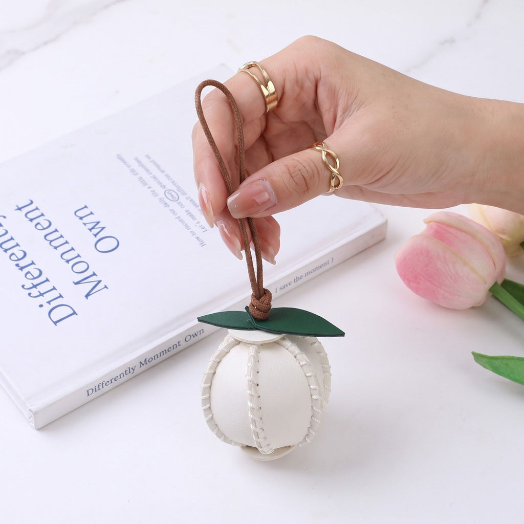 2-Piece Womens Faux Leather Bag Charm with Cord Loop Leaf Accent and Textured Stitch Detail