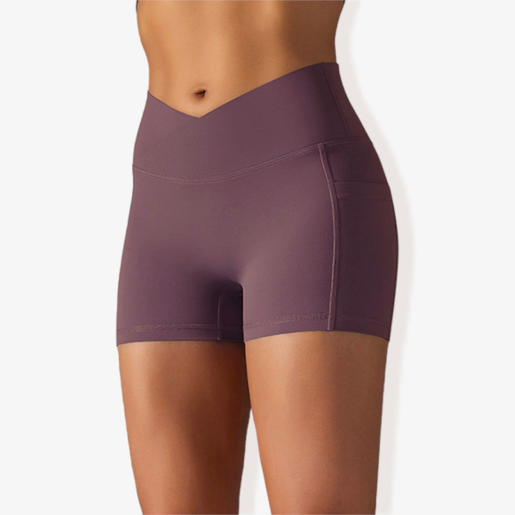 Pantalones cortos deportivos ajustados con cintura alta, bolsillos y banda en la cintura en forma de V