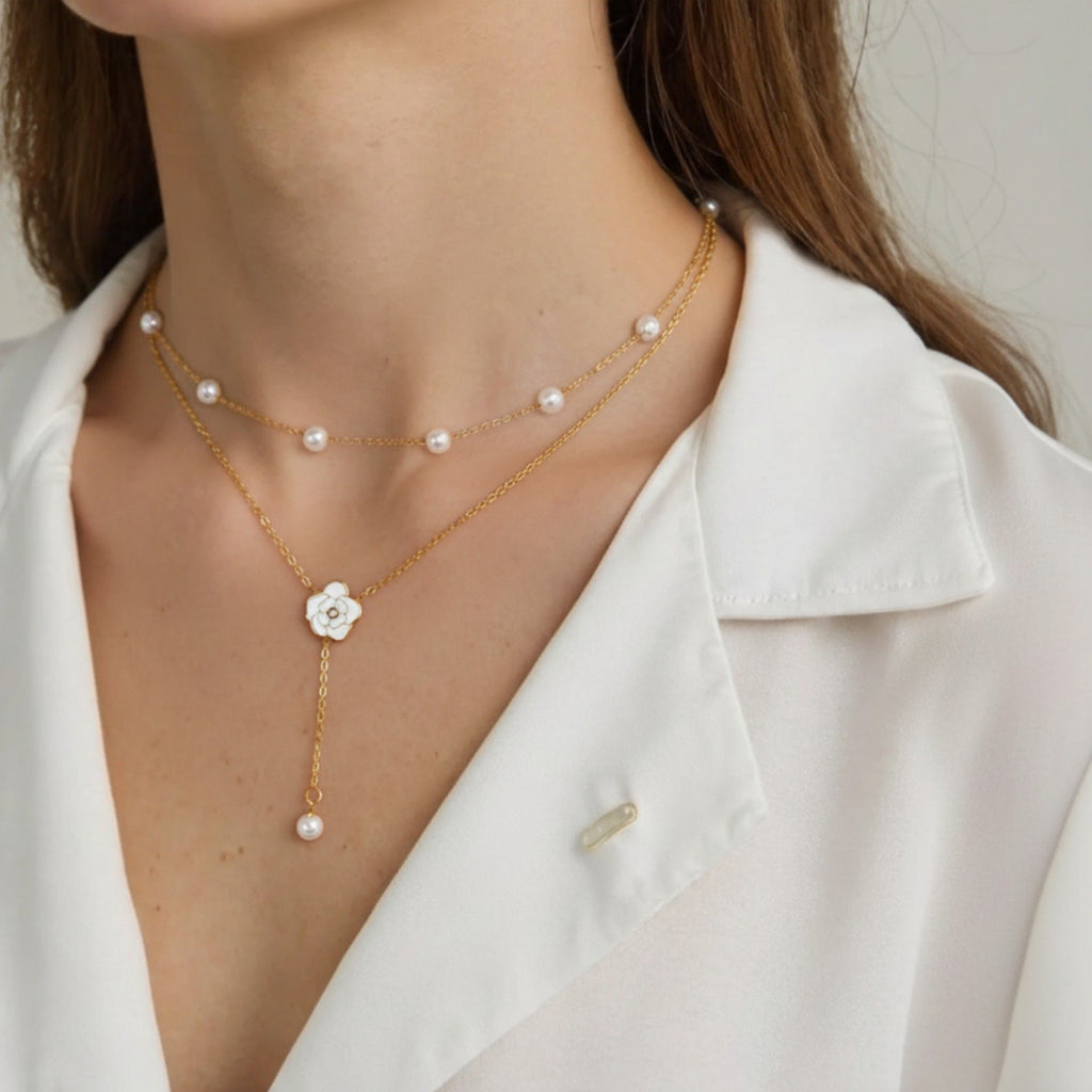 Layered Chain Necklace with Delicate Pearl Accents and Open Petal Floral Pendant Featuring Droplet Charm Detail