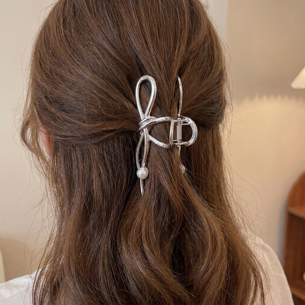 Bow Shaped Hair Clip with Faux Pearl Accent and Open Frame Design 4.5x1in