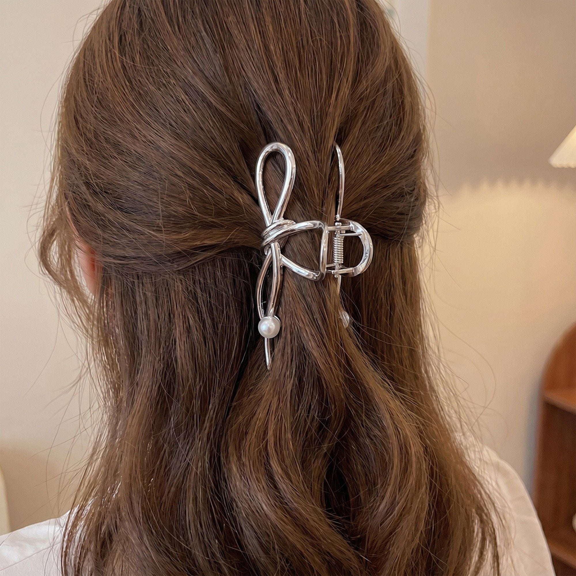 Bow Shaped Hair Clip with Faux Pearl Accent and Open Frame Design 4.5x1in