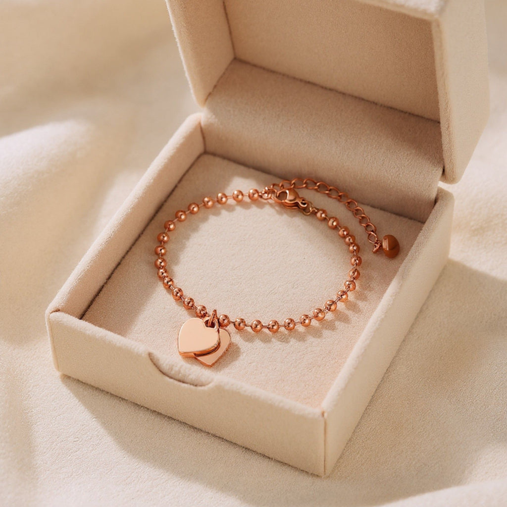 Beaded Bracelet with Dual Heart Charms Elegant Polished Metal Accents Adjustable Chain Detail for a Refined Valentine Look