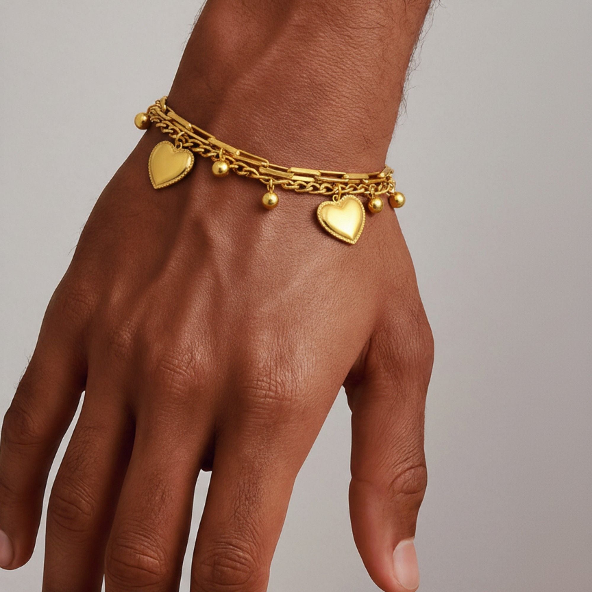 Layered Chain Bracelet with Dual Heart Charms and Dangling Bead Accents for a Playful Feminine Accessory with Modern Detail