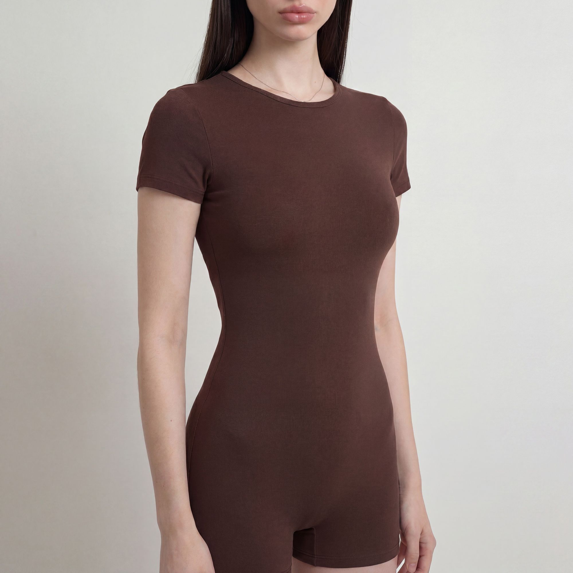 Short Sleeve One Piece Active Romper with Crew Neck Built In Padding Fitted Shorts and Smooth Stretch Fabric