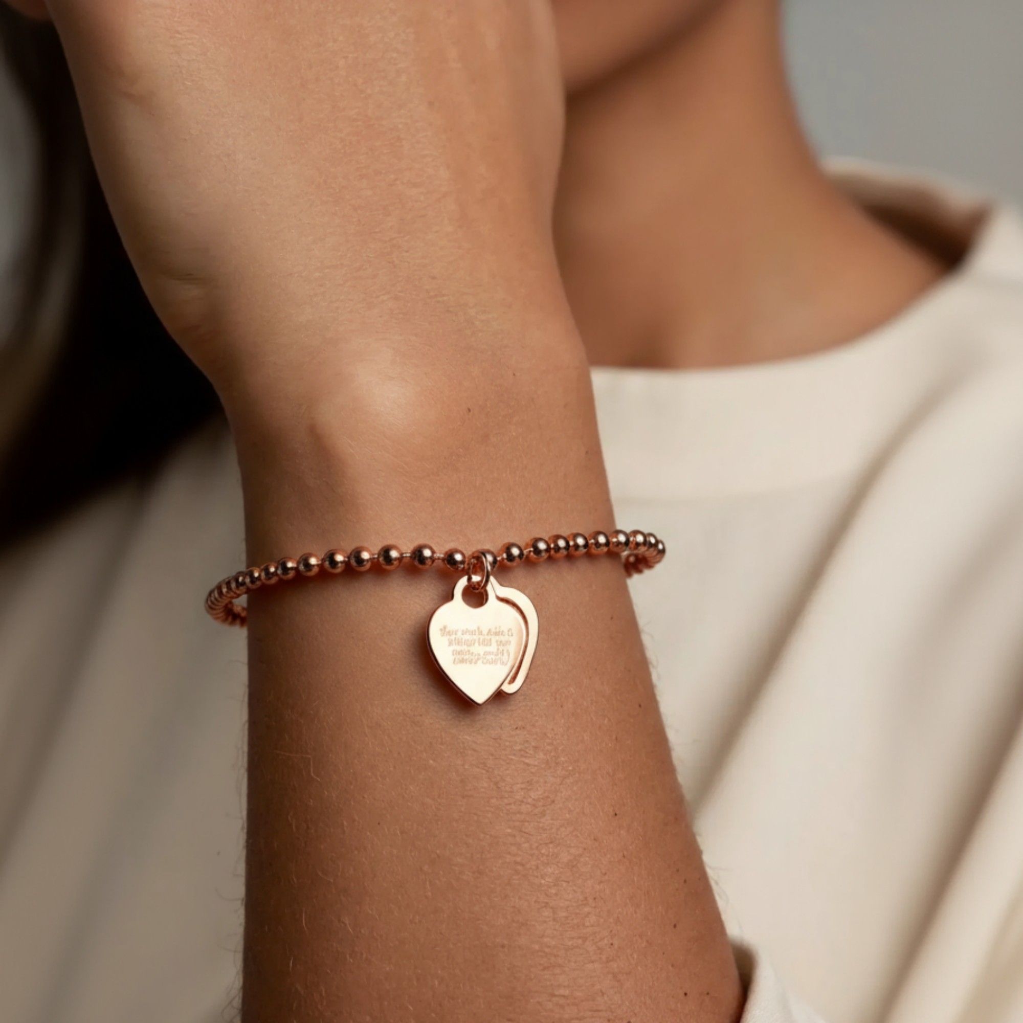 Beaded Bracelet with Dual Heart Charms Elegant Polished Metal Accents Adjustable Chain Detail for a Refined Valentine Look