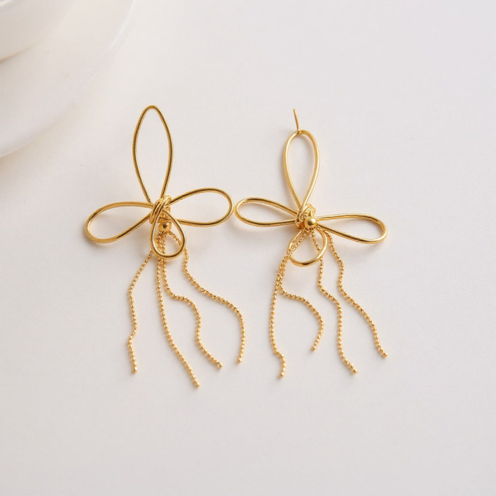 Women's Delicate Wire Bow Drop Earrings with Sculpted Loop Design and Sleek Chain Tassel Accent for Modern Elegance