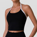 Pink women's sports bra with halter neck, cropped and contrast trim