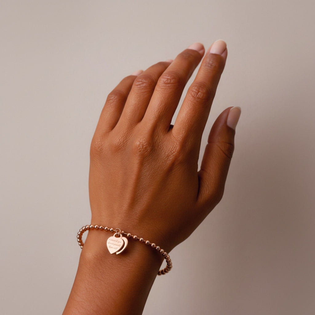 Beaded Bracelet with Dual Heart Charms Elegant Polished Metal Accents Adjustable Chain Detail for a Refined Valentine Look