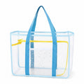 Green tote bag with pockets, front pocket and shoulder handles