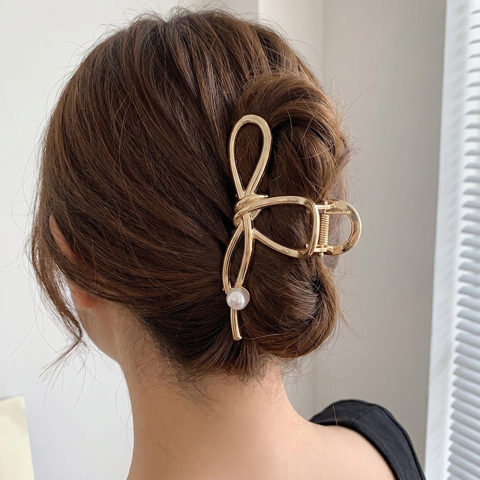 Bow Shaped Hair Clip with Faux Pearl Accent and Open Frame Design 4.5x1in