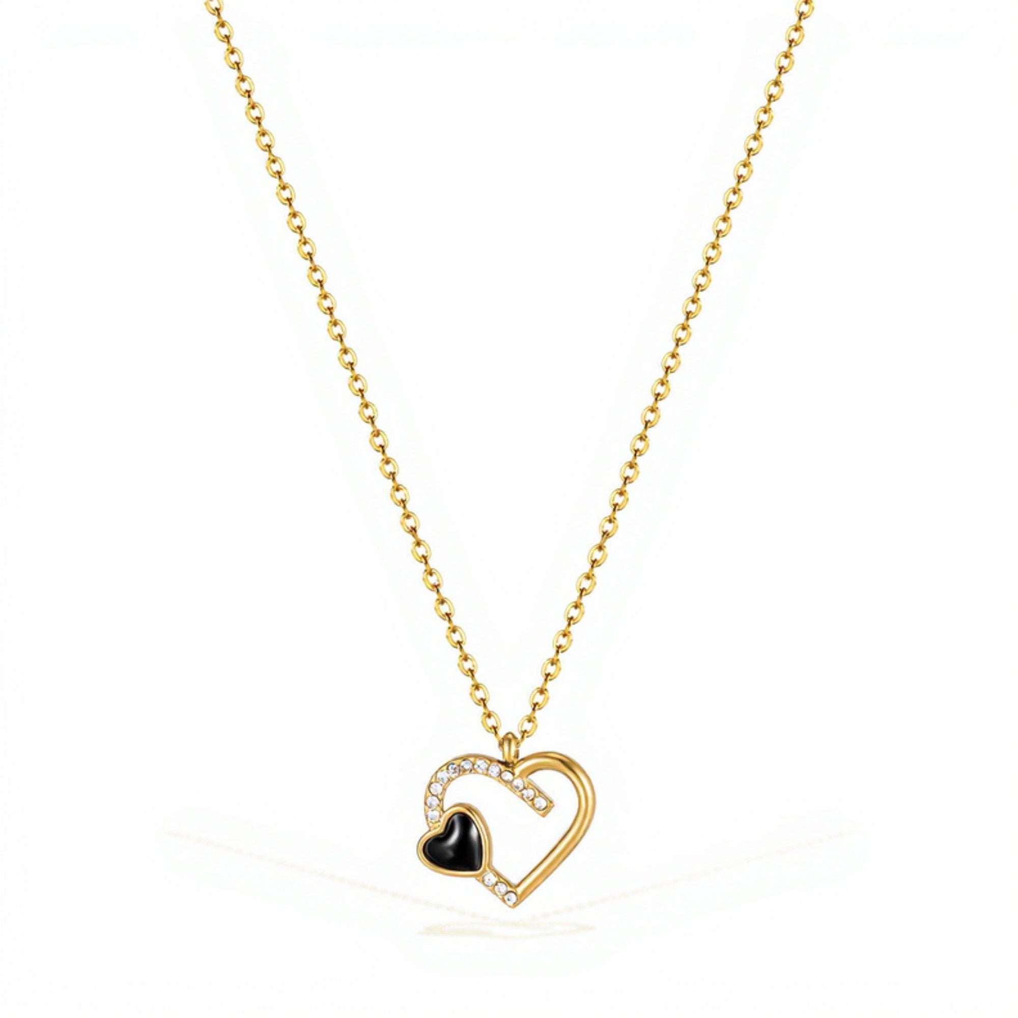 Interlocking Heart Pendant Necklace with Crystal Accents and Polished Metal Design on a Delicate Chain