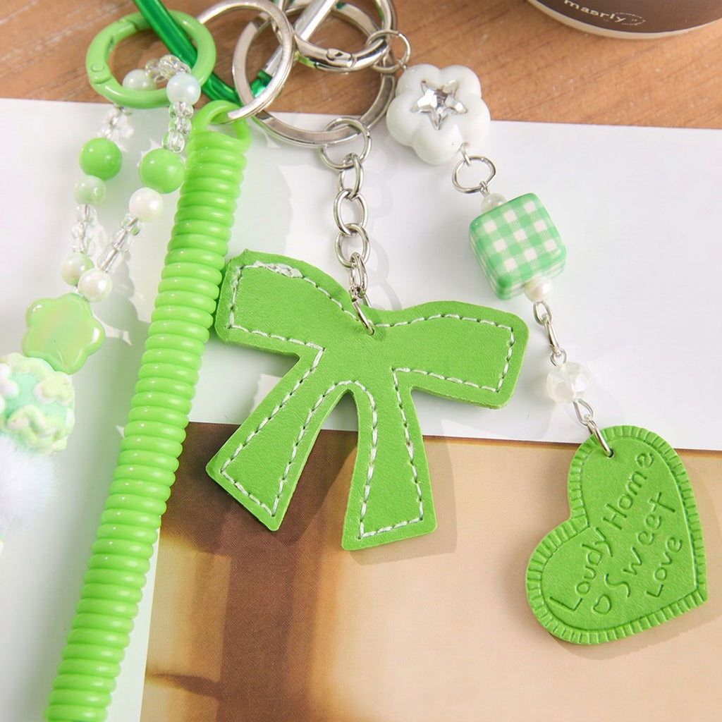 Multi-Element Bag Charm with Hanging Strap and Decorative Accents