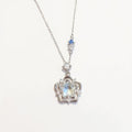 Women's Star Flower Pendant Necklace with Crystal Center Stone and Accent Gem Detailing