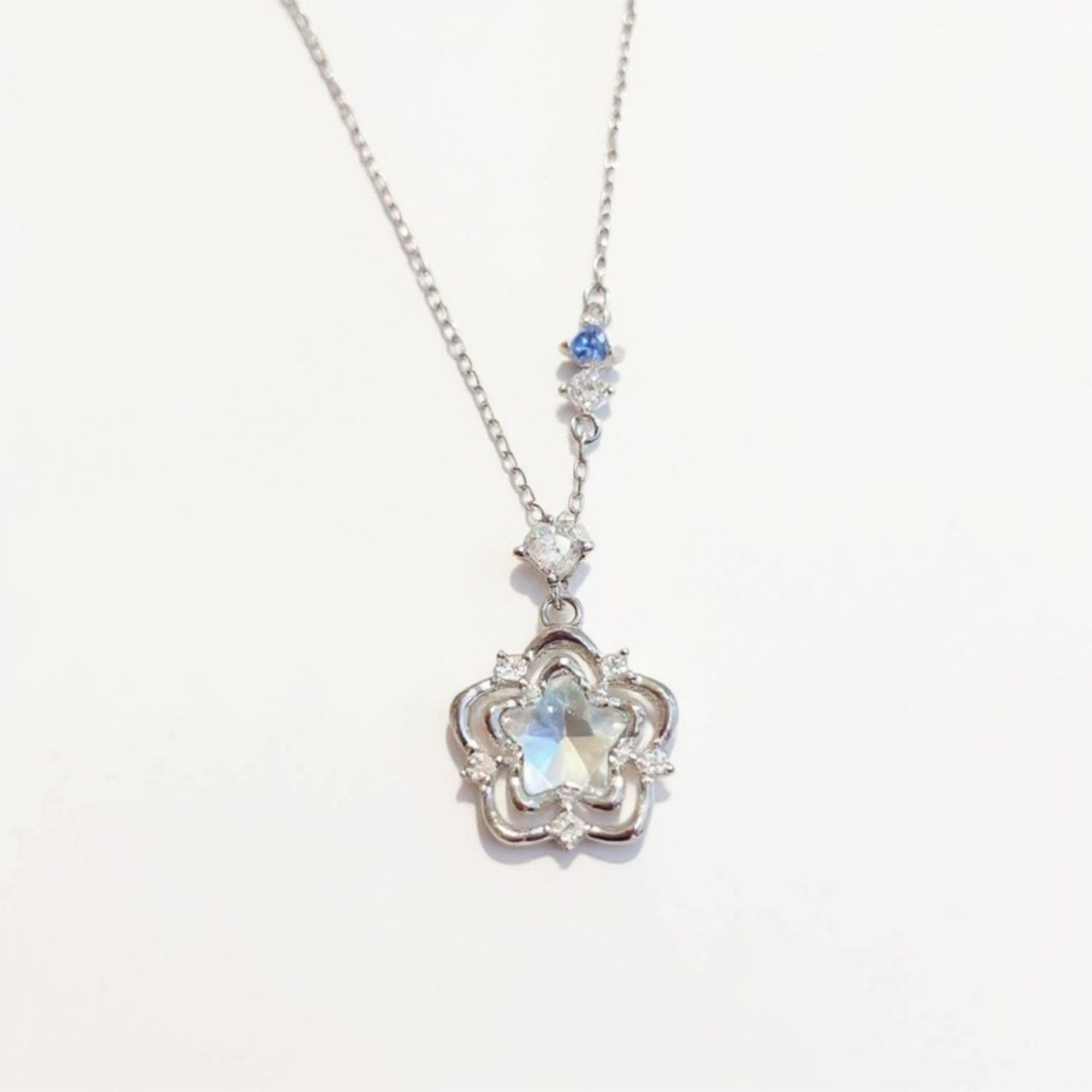 Women's Star Flower Pendant Necklace with Crystal Center Stone and Accent Gem Detailing