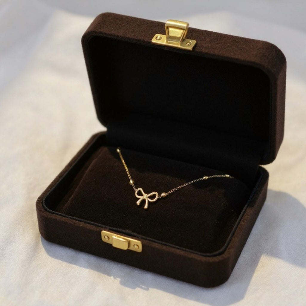 Women's Bow Pendant Necklace with Dainty Beaded Chain Design