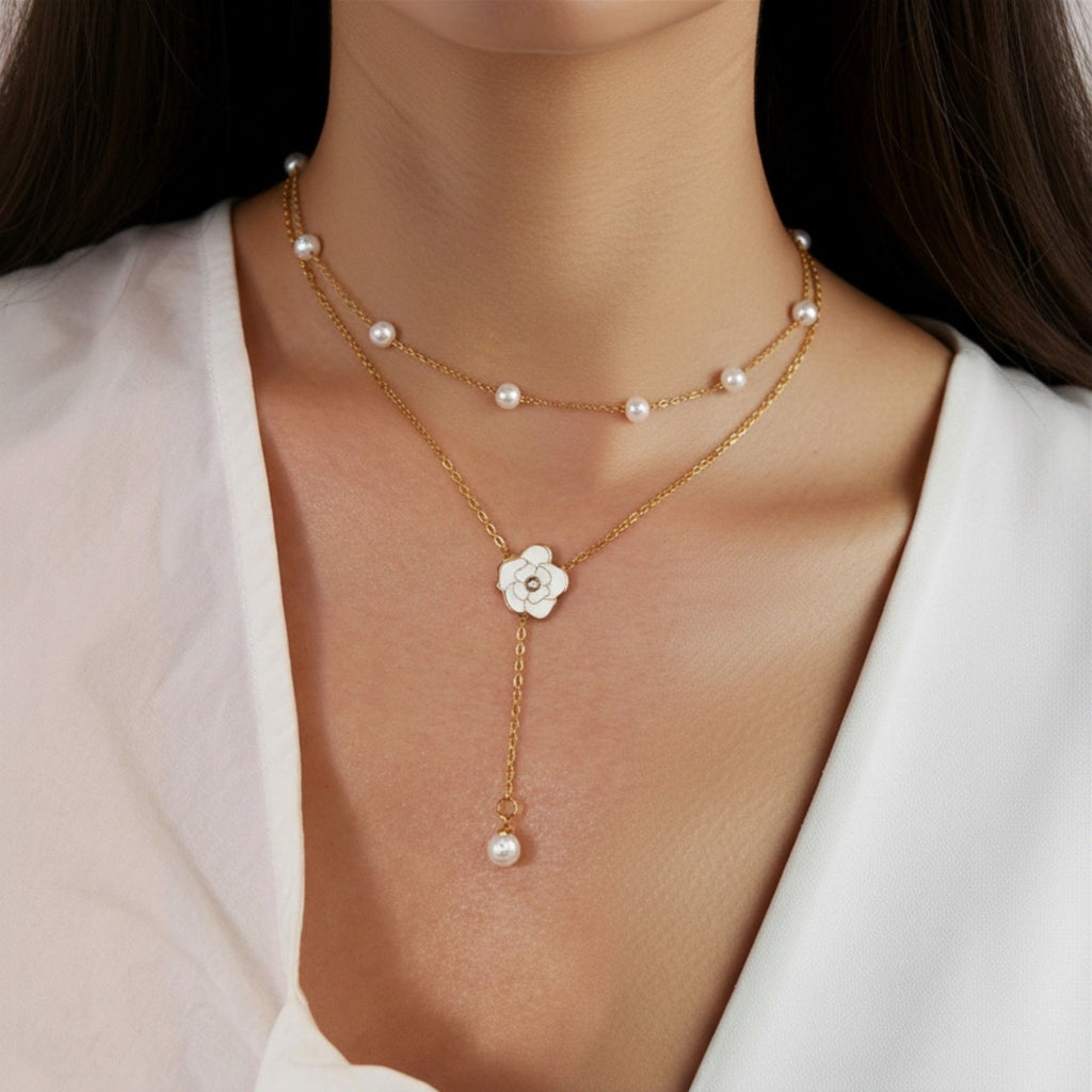 Layered Chain Necklace with Delicate Pearl Accents and Open Petal Floral Pendant Featuring Droplet Charm Detail