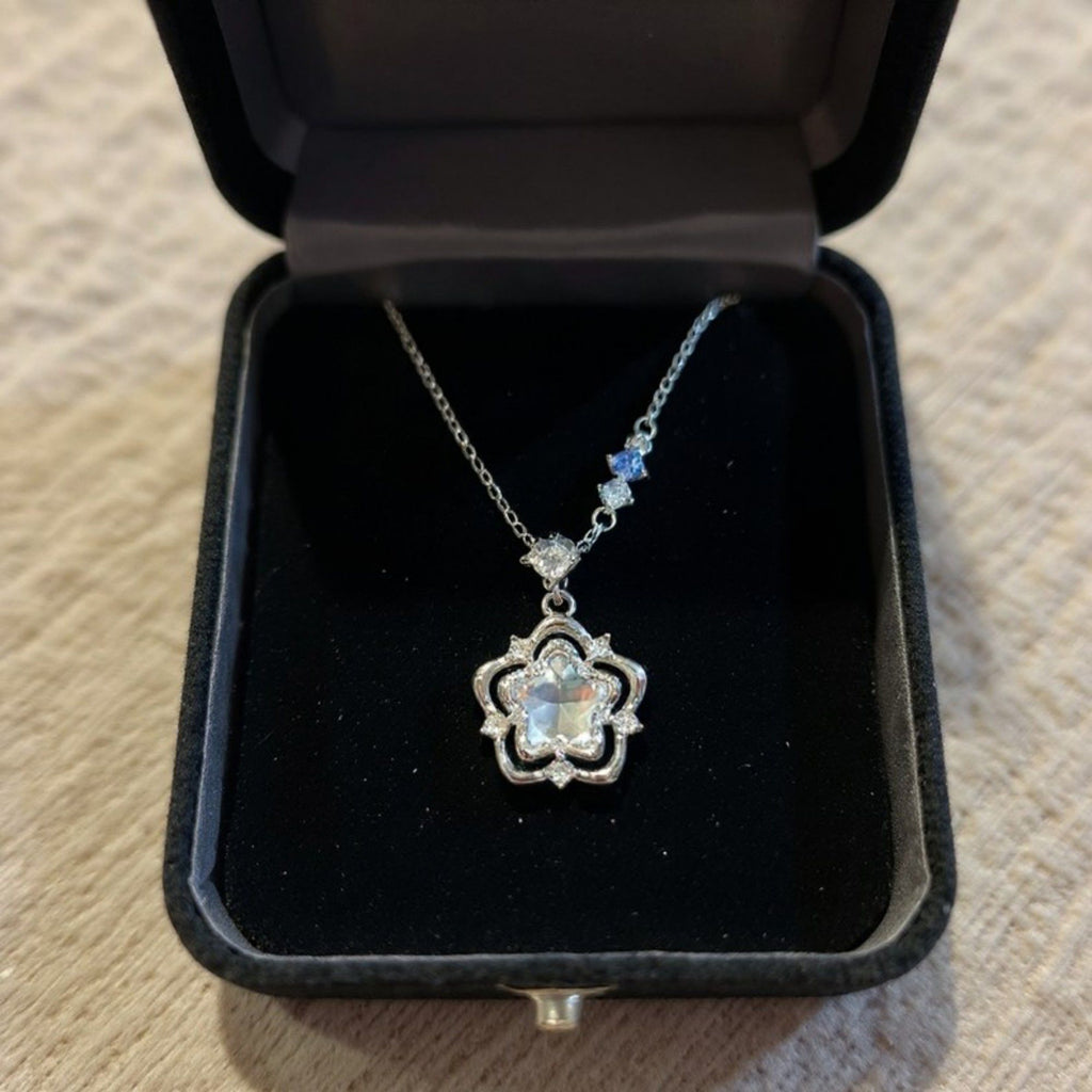 Women's Star Flower Pendant Necklace with Crystal Center Stone and Accent Gem Detailing