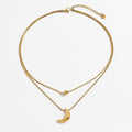 Layered Necklace Set with Minimalist Bead Charm and Sculpted Crescent Moon Pendant for a Delicate Refined Everyday Statement