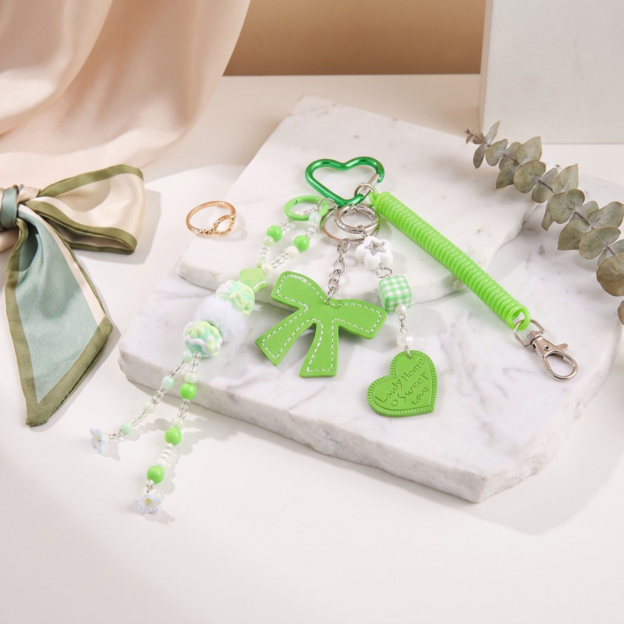 Multi-Element Bag Charm with Hanging Strap and Decorative Accents