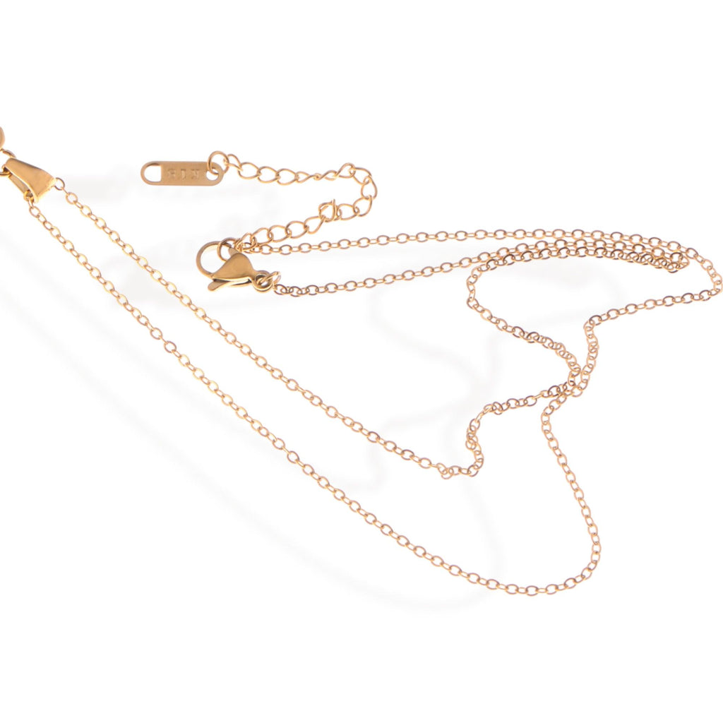Gold Tone Pendant Necklace with Rectangular Crystal and Starburst Accent