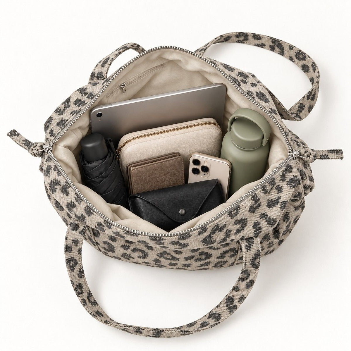 Leopard Print Barrel Shoulder Bag with Zip Closure and Interior Pockets