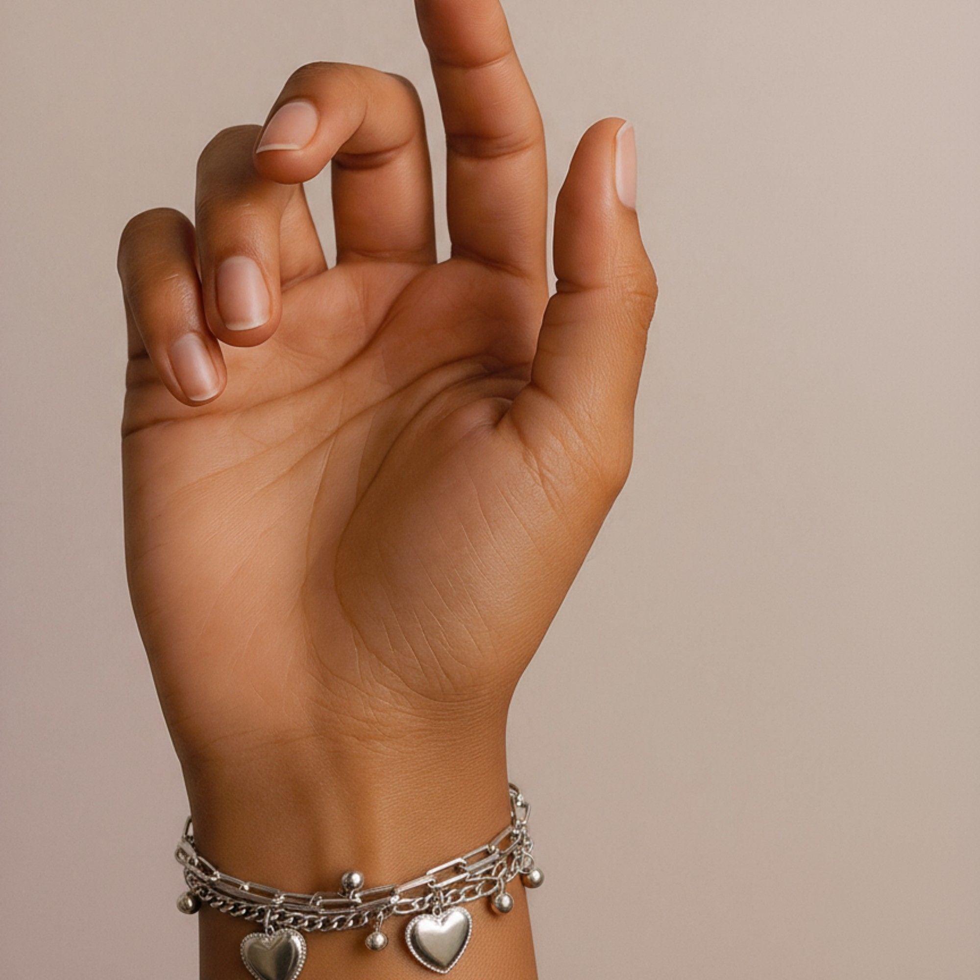 Layered Chain Bracelet with Dual Heart Charms and Dangling Bead Accents for a Playful Feminine Accessory with Modern Detail