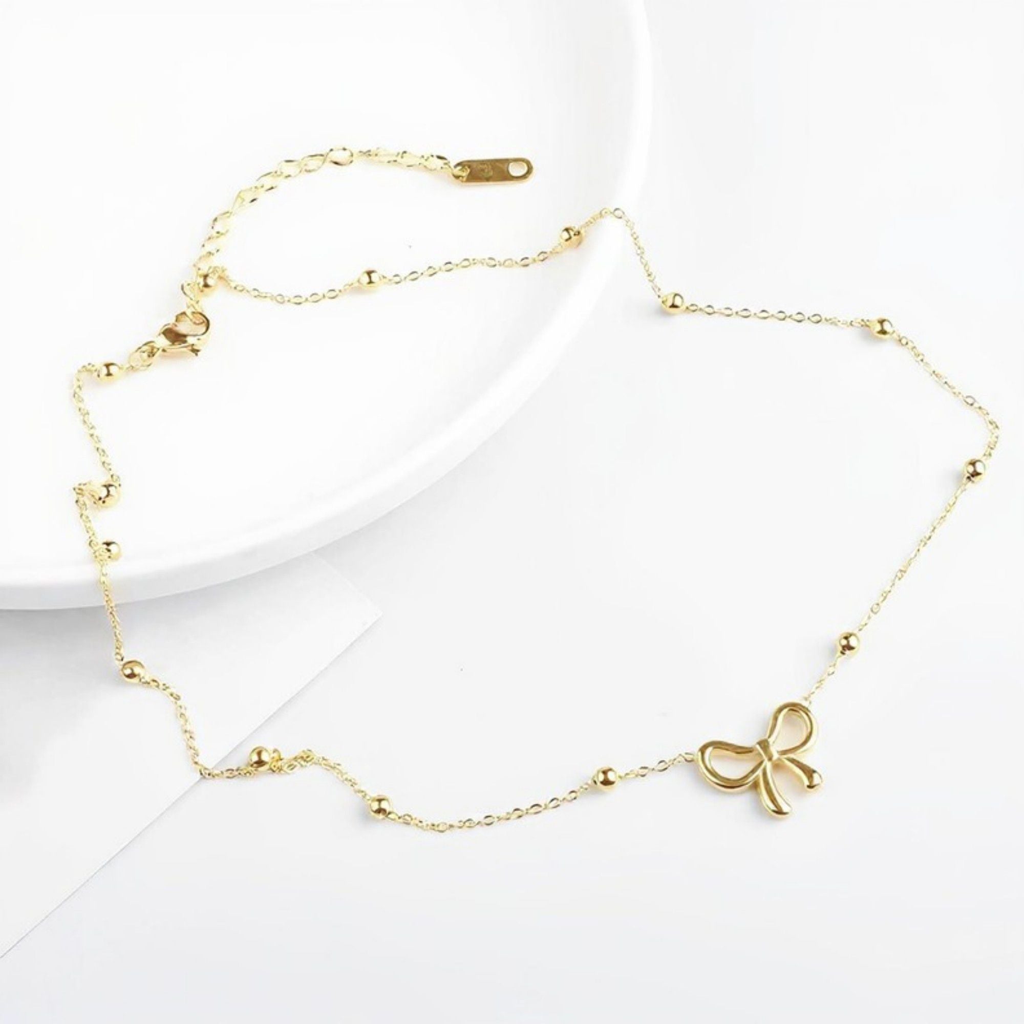 Women's Bow Pendant Necklace with Dainty Beaded Chain Design