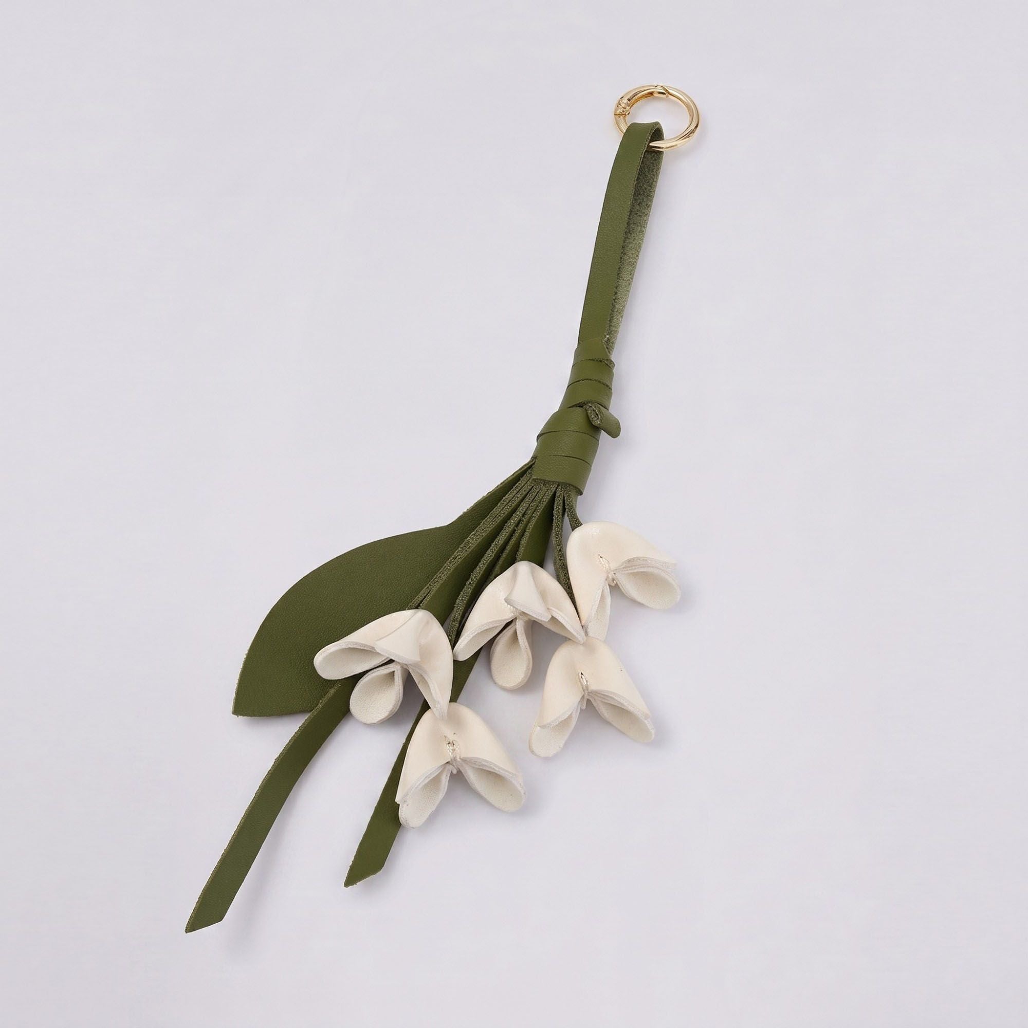 Floral Bag Charm with Tassel Strap and Gold Tone Ring