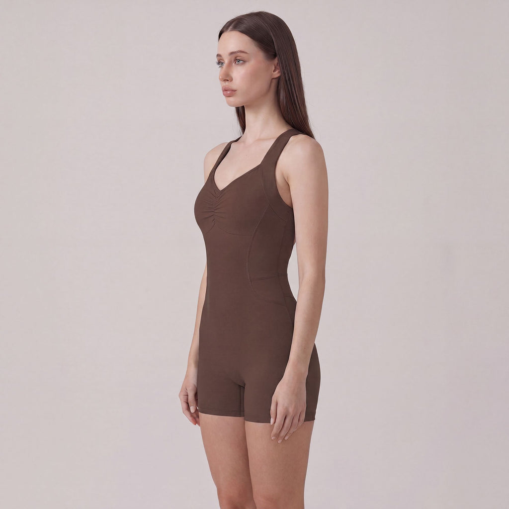 Sleeveless Active Romper with Cross Back Straps Ruched Bust Contour Seams and Fitted Shorts