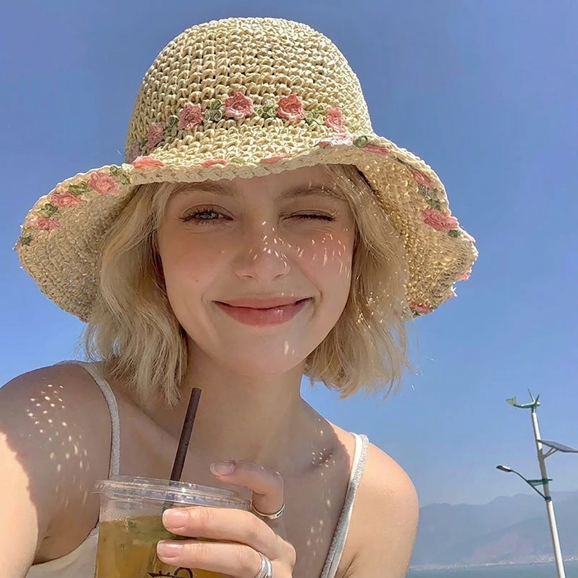 Crochet Bucket Sun Hat with Floral Embroidery and Wavy Brim Design