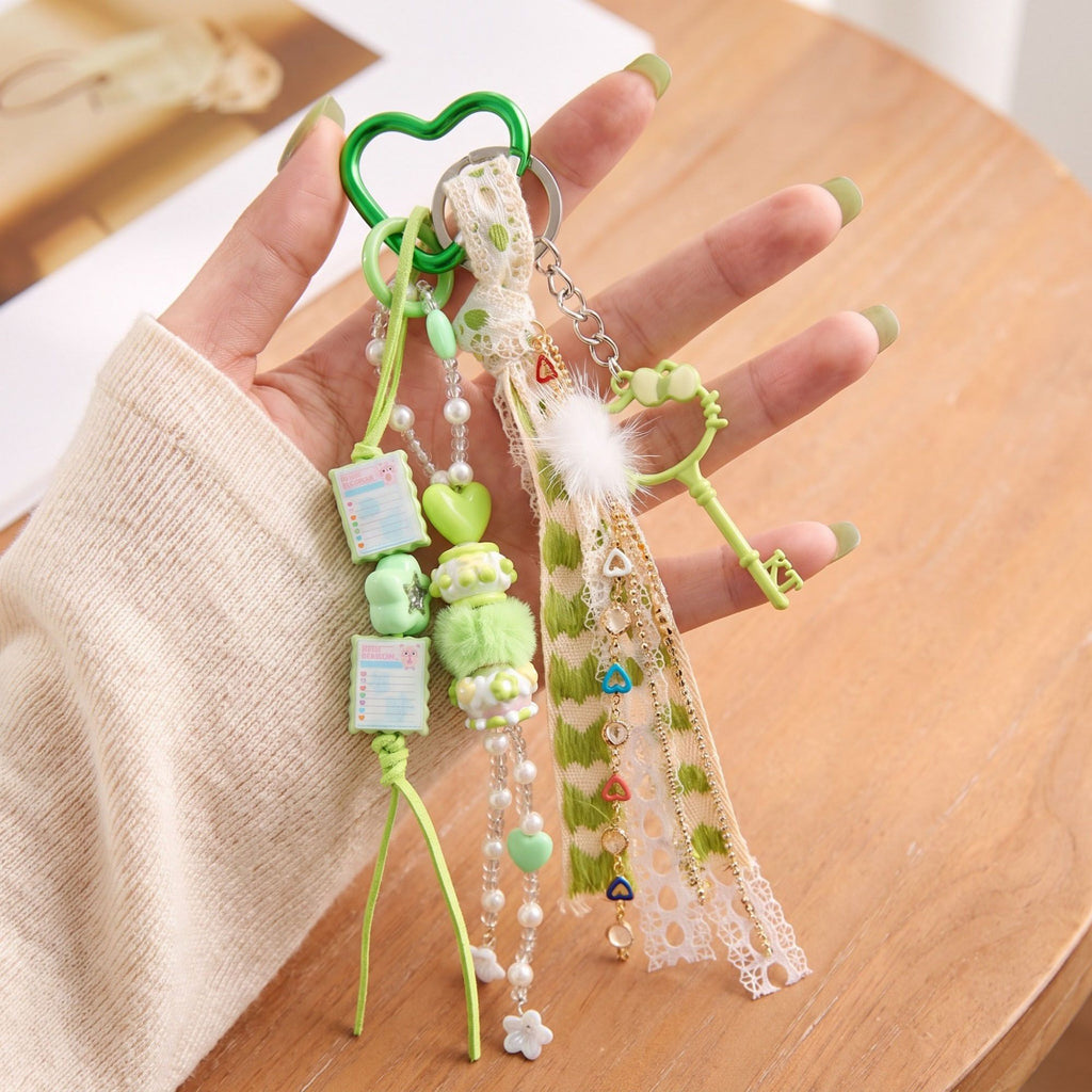 Multi-Element Bag Charm with Hanging Strap and Decorative Accents