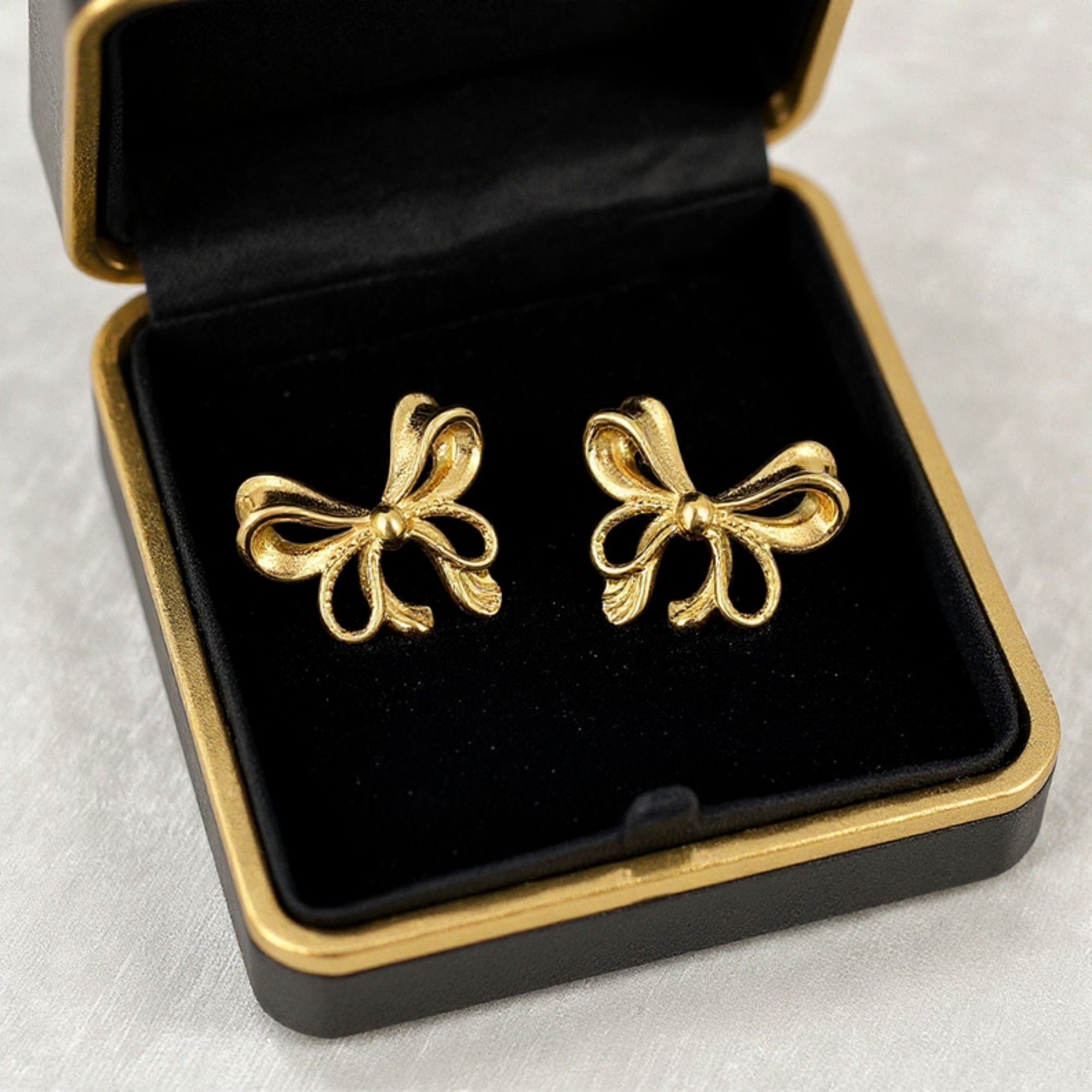 Bow Knot Stud Earrings with Open Loop Ribbon Design and Delicate Sculpted Details for a Feminine Elegant Look