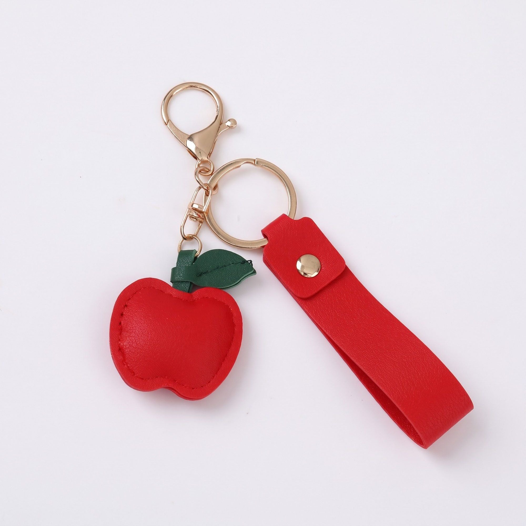 Apple Bag Charm with Faux Leather Strap and Gold Tone Hardware