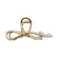 Bow Shaped Hair Clip with Faux Pearl Accent and Open Frame Design 4.5x1in