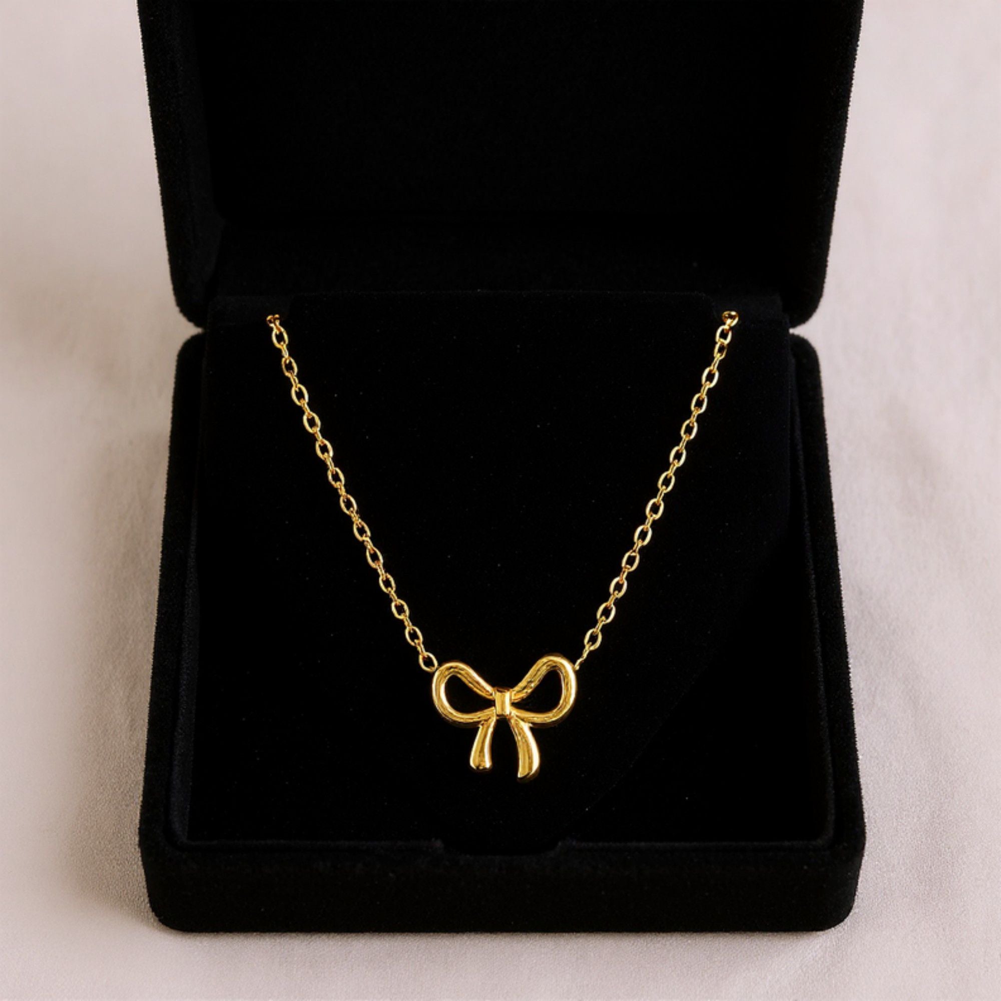 Women's Bow Pendant Necklace with Polished Metal Finish and Minimalist Chain Design for Everyday Feminine Style