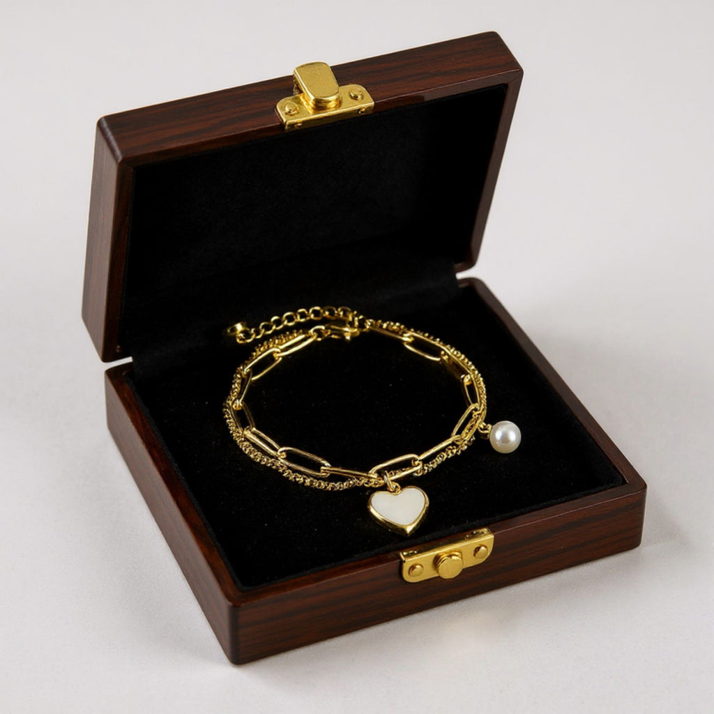 Double Layer Chain Bracelet with Heart Charm Pendant and Smooth Bead Drop Detail for a Delicate Feminine Layered Look
