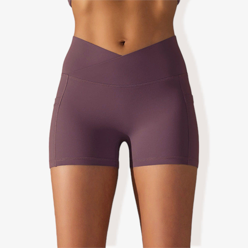 Pantalones cortos deportivos ajustados con cintura alta, bolsillos y banda en la cintura en forma de V