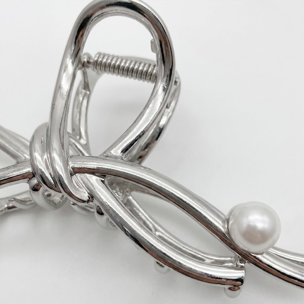 Bow Shaped Hair Clip with Faux Pearl Accent and Open Frame Design 4.5x1in