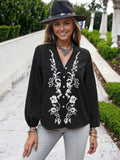 Blusa con cuello en V y mangas de obispo con estampado floral