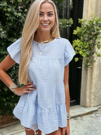 Blusa babydoll texturizada con mangas abullonadas y dobladillo con volantes