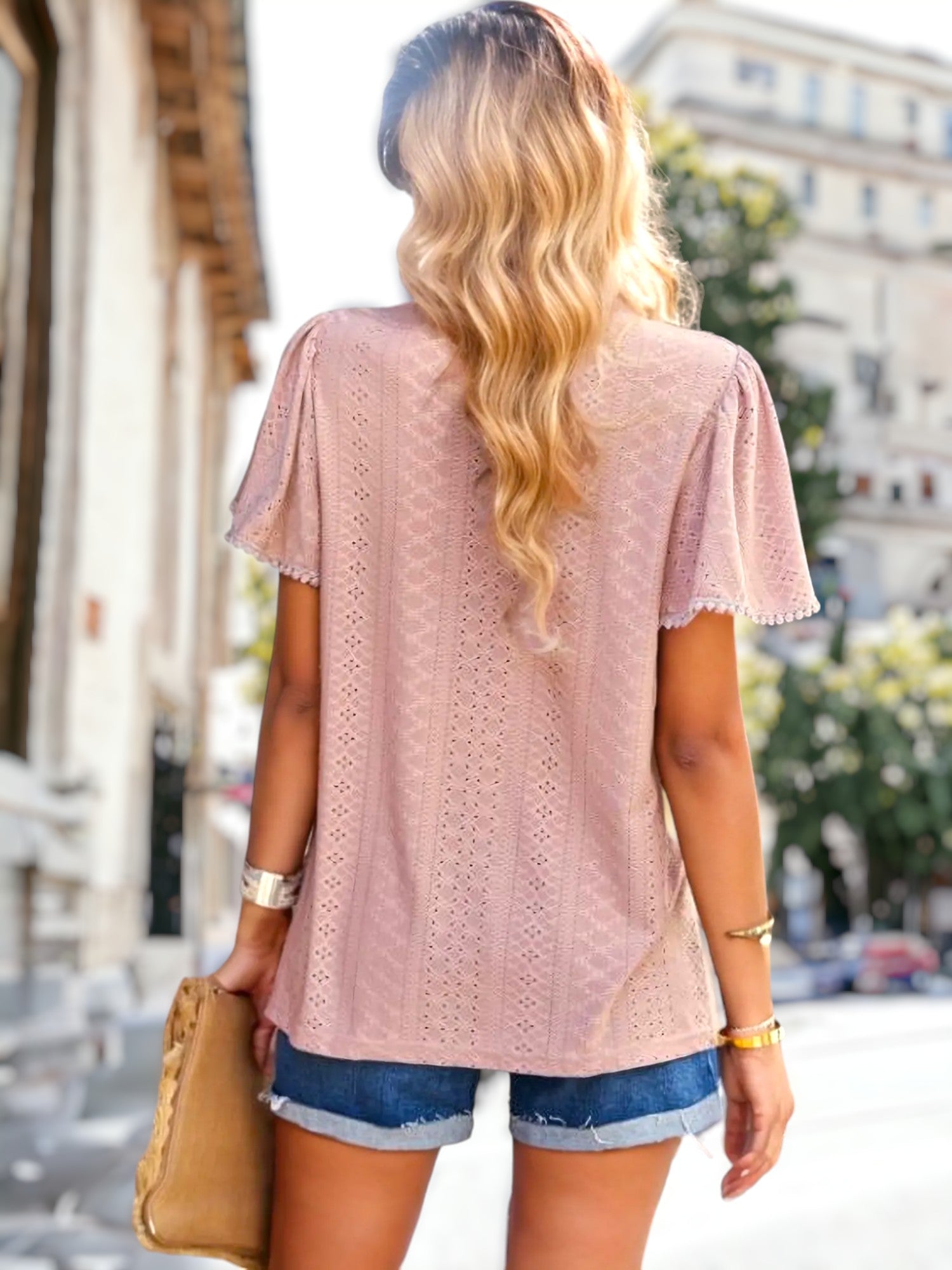 Blusa con ojales y detalle plisado