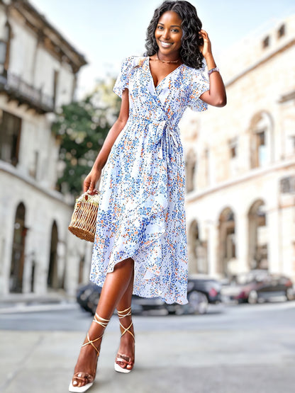 Vestido cruzado con mangas abullonadas y estampado floral 