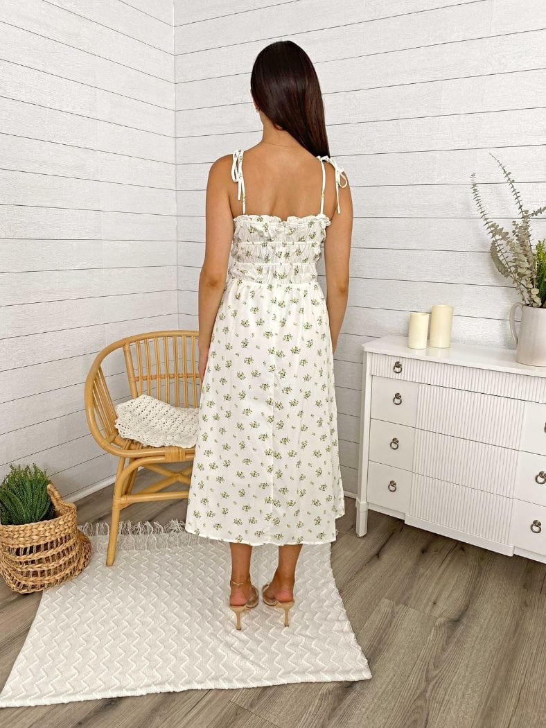 Vestido midi con abertura en la pierna, tirantes y lazo con flores 