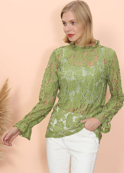Blusa transparente con mangas abullonadas y encaje en capas